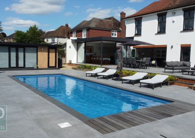 Luxury Pool with concealed slatted solar cover, sun deck and pool house