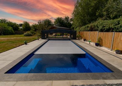 Concealed solar pool cover